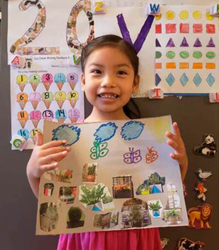 image of girl holding school poster