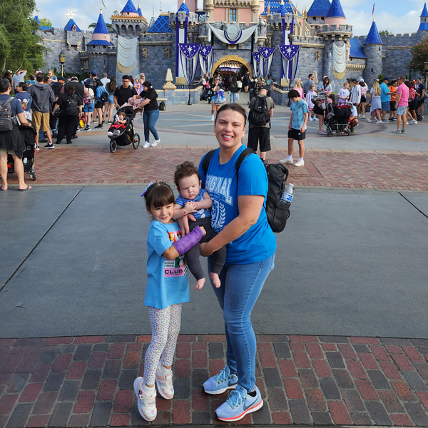 Decorative image of Cyntia Flores and her children at Disney world